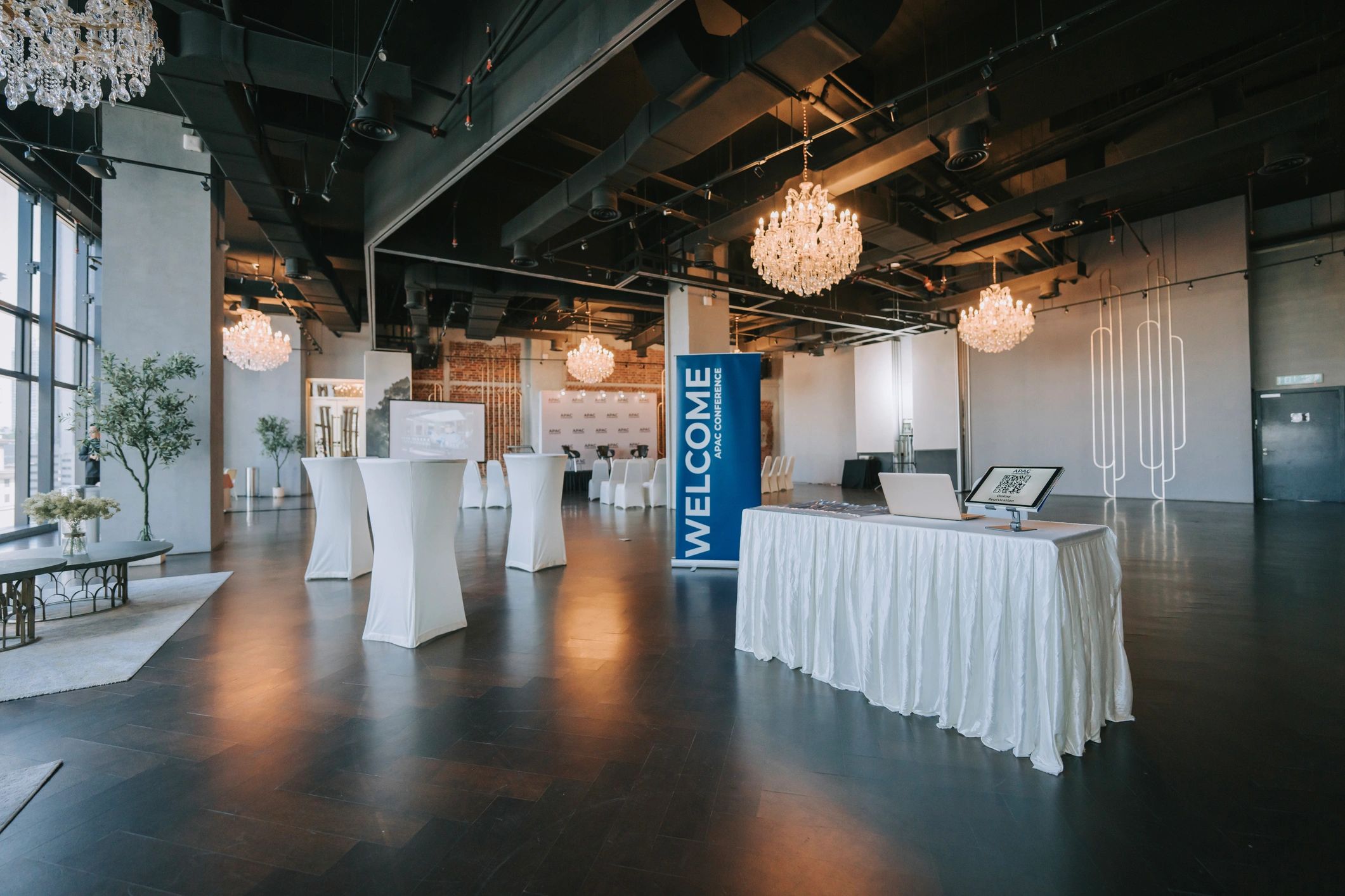 Modern business conference entrance with digital check-in display